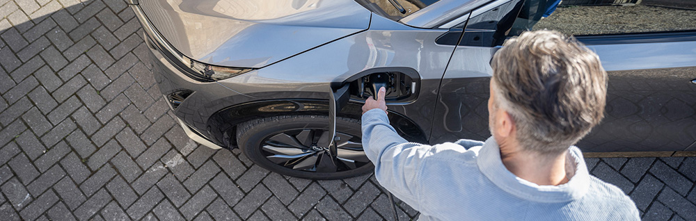 Man charging EV